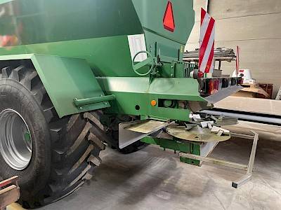 Rear view of a green Kuxmann lime spreader.