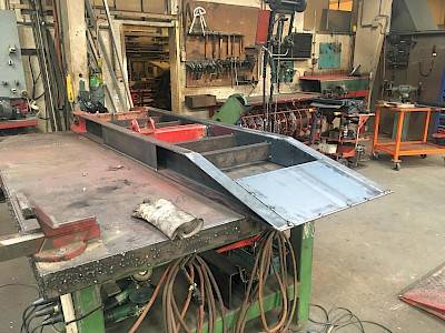 Trailer ramp in maintenance on workbench