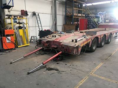 Drive-up ramps removed from trailer in workshop
