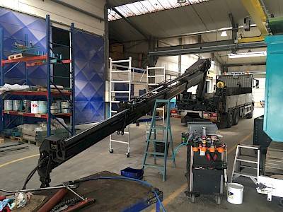 trailer crane under maintenance in workshop