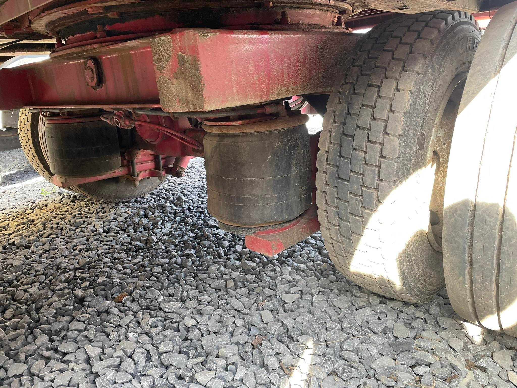 Close-up of the underside of a Record flatbed trailer.