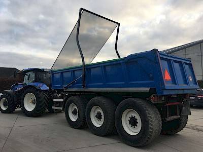 Deman hydraulic arms system puts cover roll over blue cargo box
